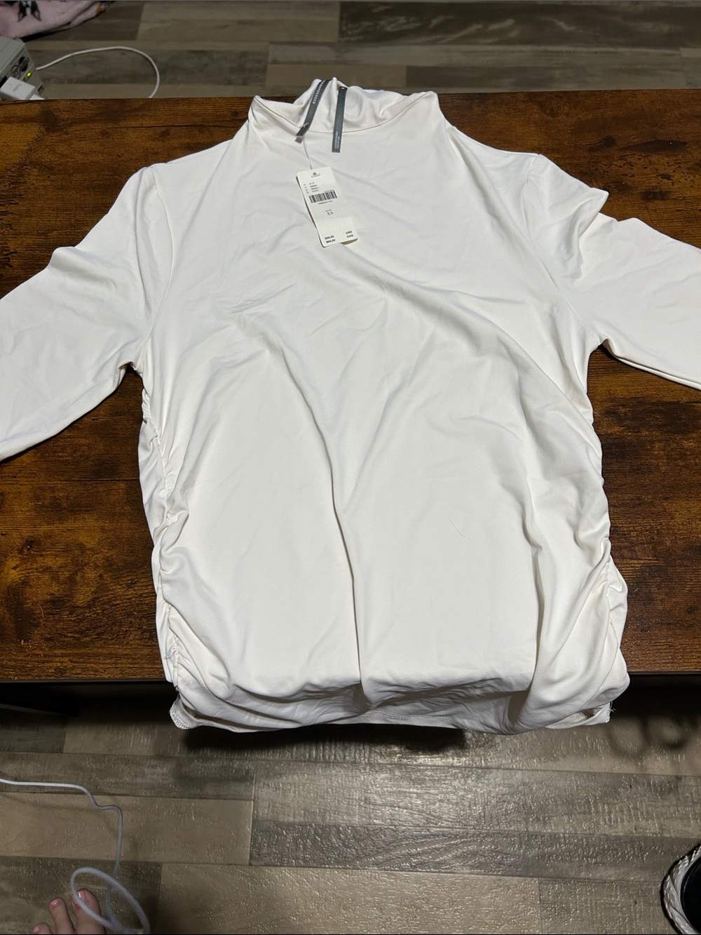 Women’s Ivory Mock Neck with 3/4 sleeves and ruffled sides